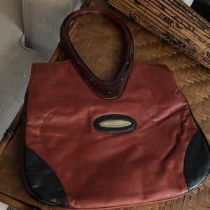 Women's maroon vintage 1970’s Leather Tote Bag with Black Accents